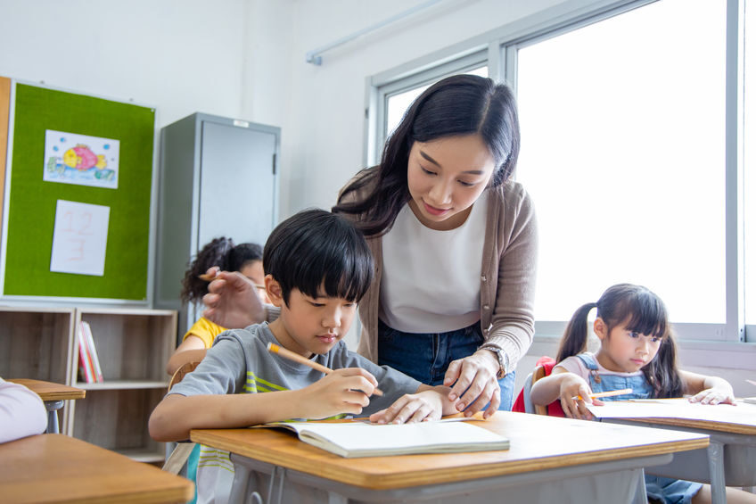 diversity-elementary-school-kid-take-note-teacher-lecture-in-cla